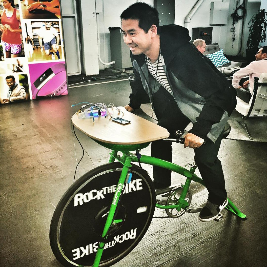 Guests pedaling the Recharge Station at an event